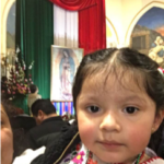 A little girl in a mexican church.