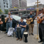 A group of people playing music on the street.