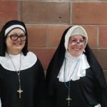 Three nuns dressed as nuns are posing for a photo.