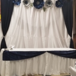 A wedding table set up with blue and white flowers.