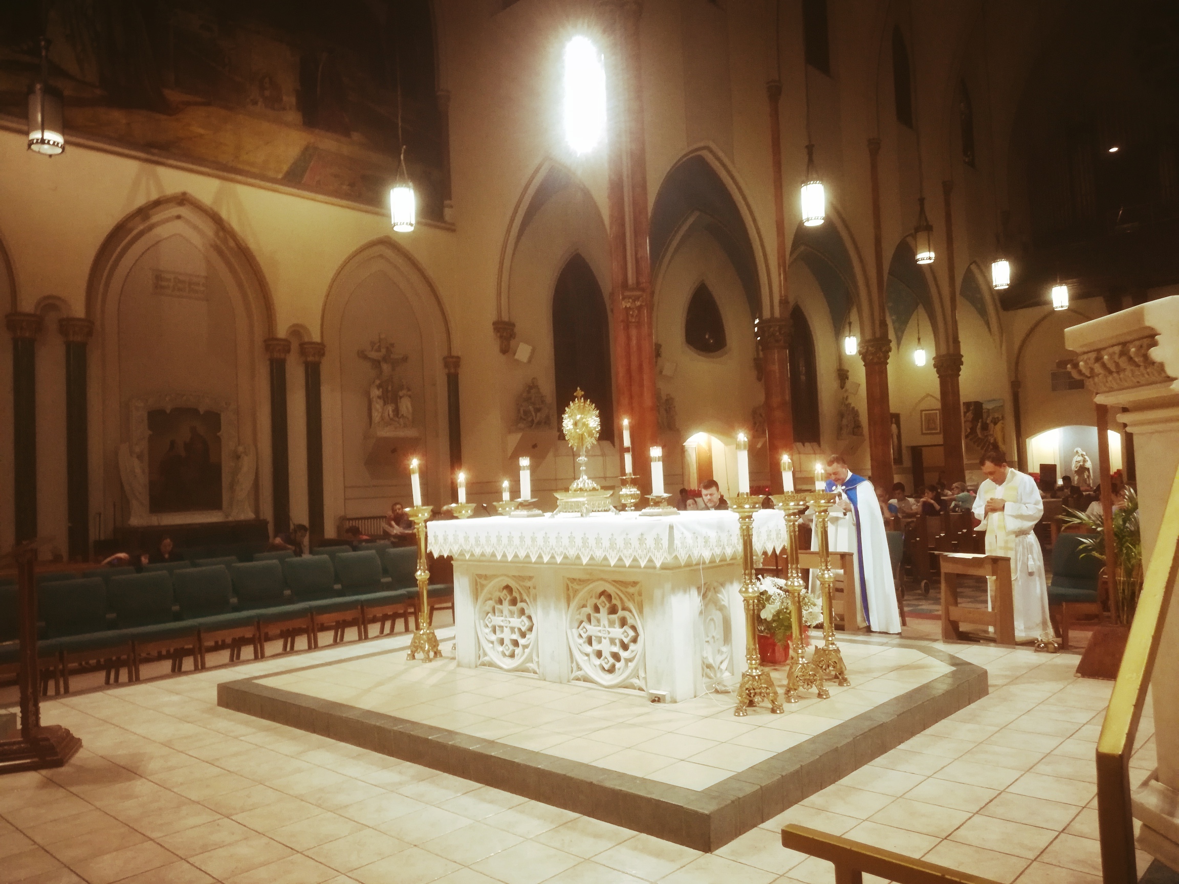 A church with a large altar and candles