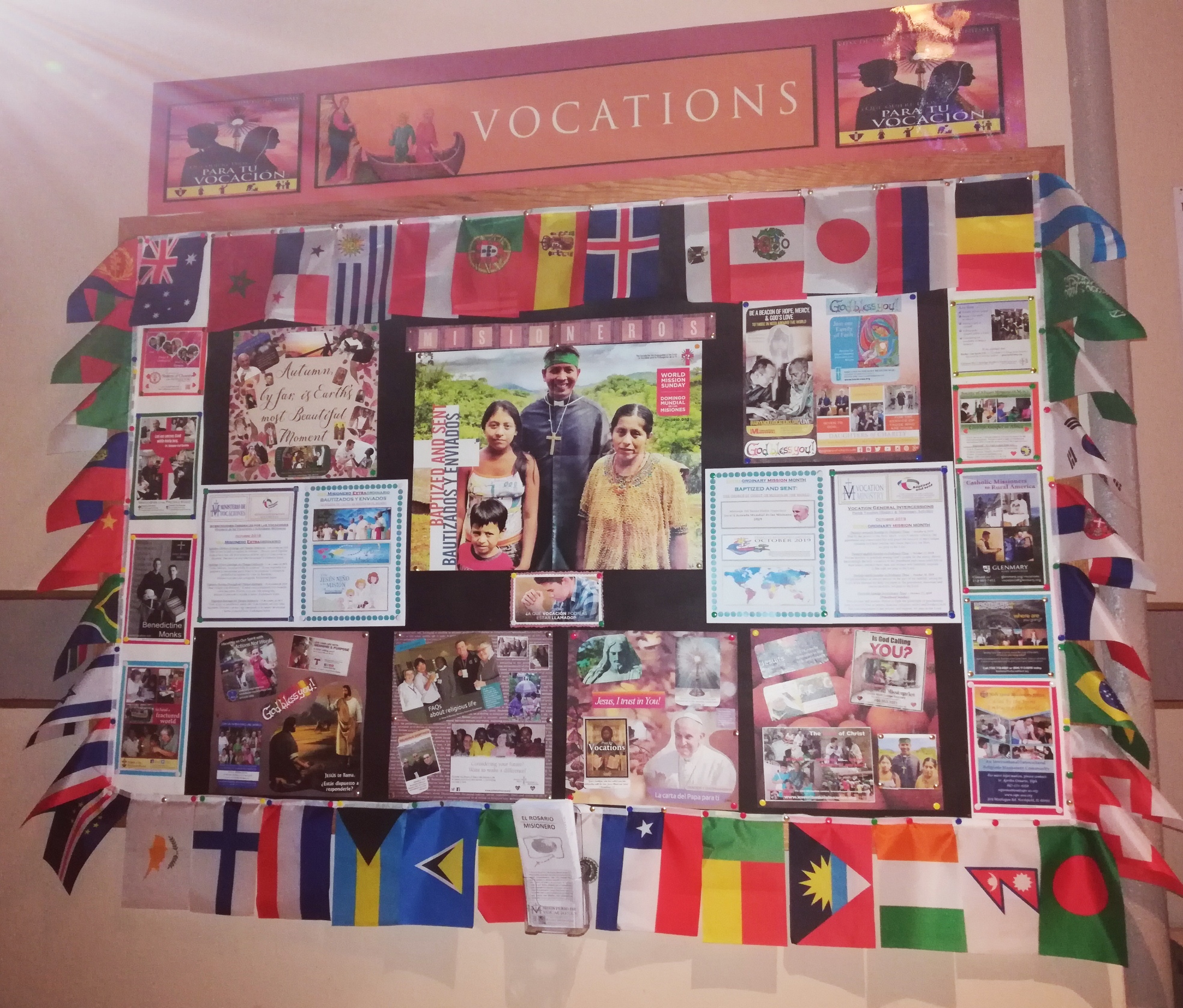 A wall with many different pictures and flags