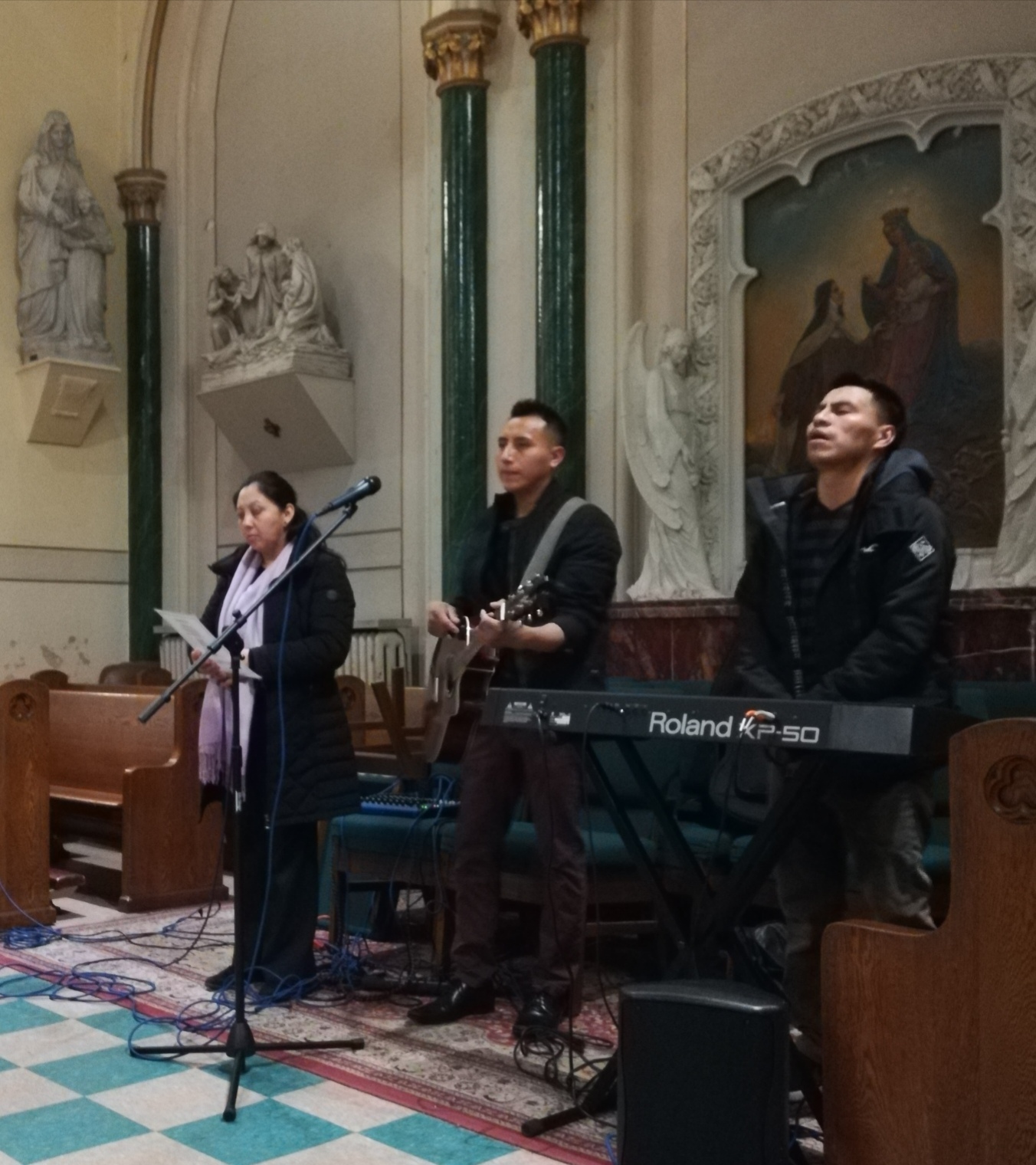 A group of people singing in a church.