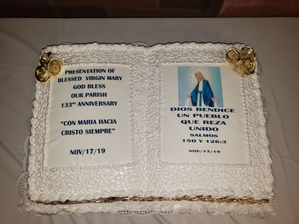 A cake with an image of the virgin mary and a prayer.