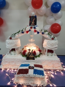 A cake with red, white and blue decorations on it.