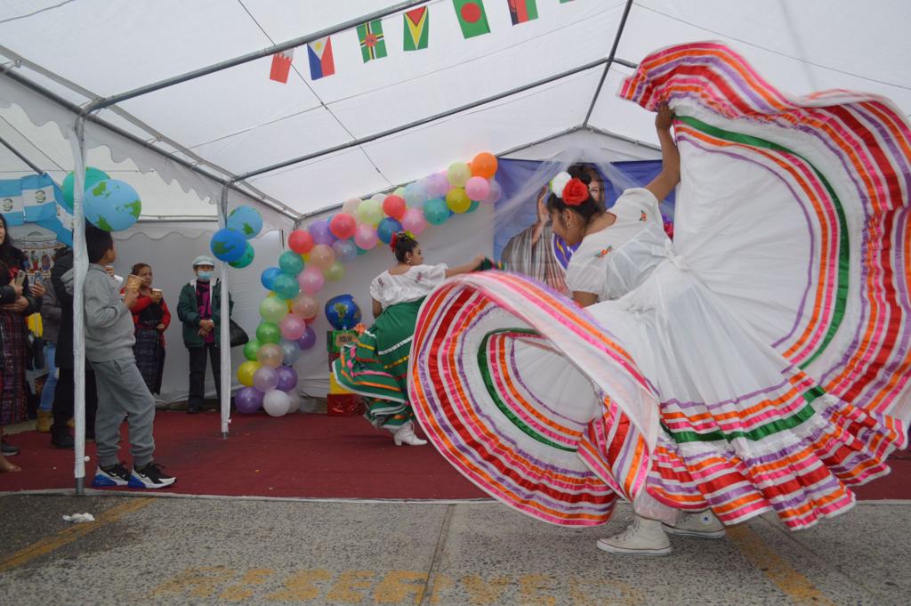 A group of people in colorful costumes dancing.